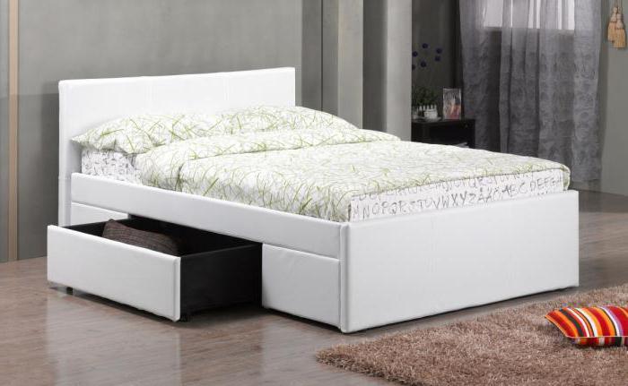 White double bed with storage boxes