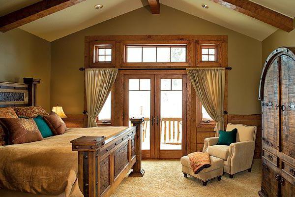 a bedroom in the style of a chalet in the attic