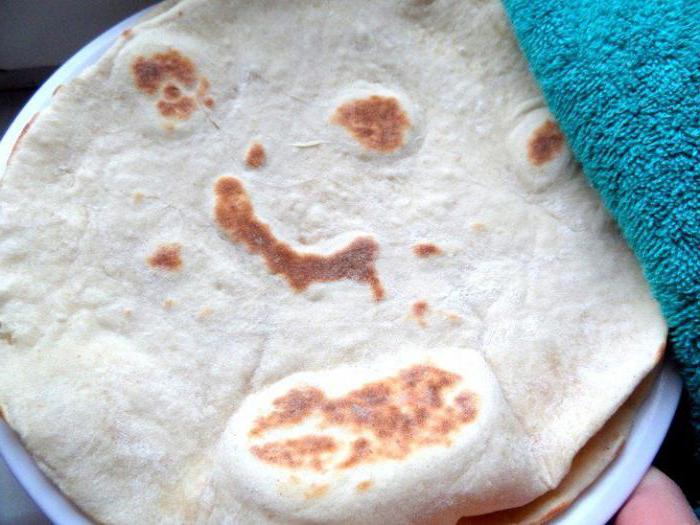 pita bread in a frying pan with cheese