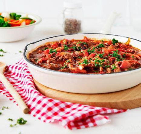 pork stew with onion tomatoes and greens