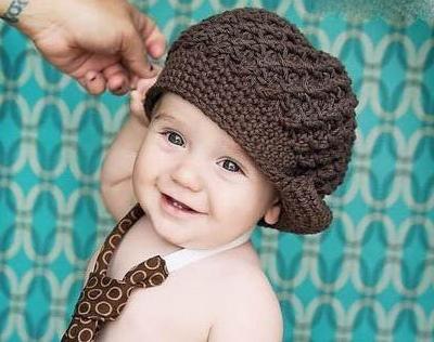 Knitted baby cap is an important part of the wardrobe